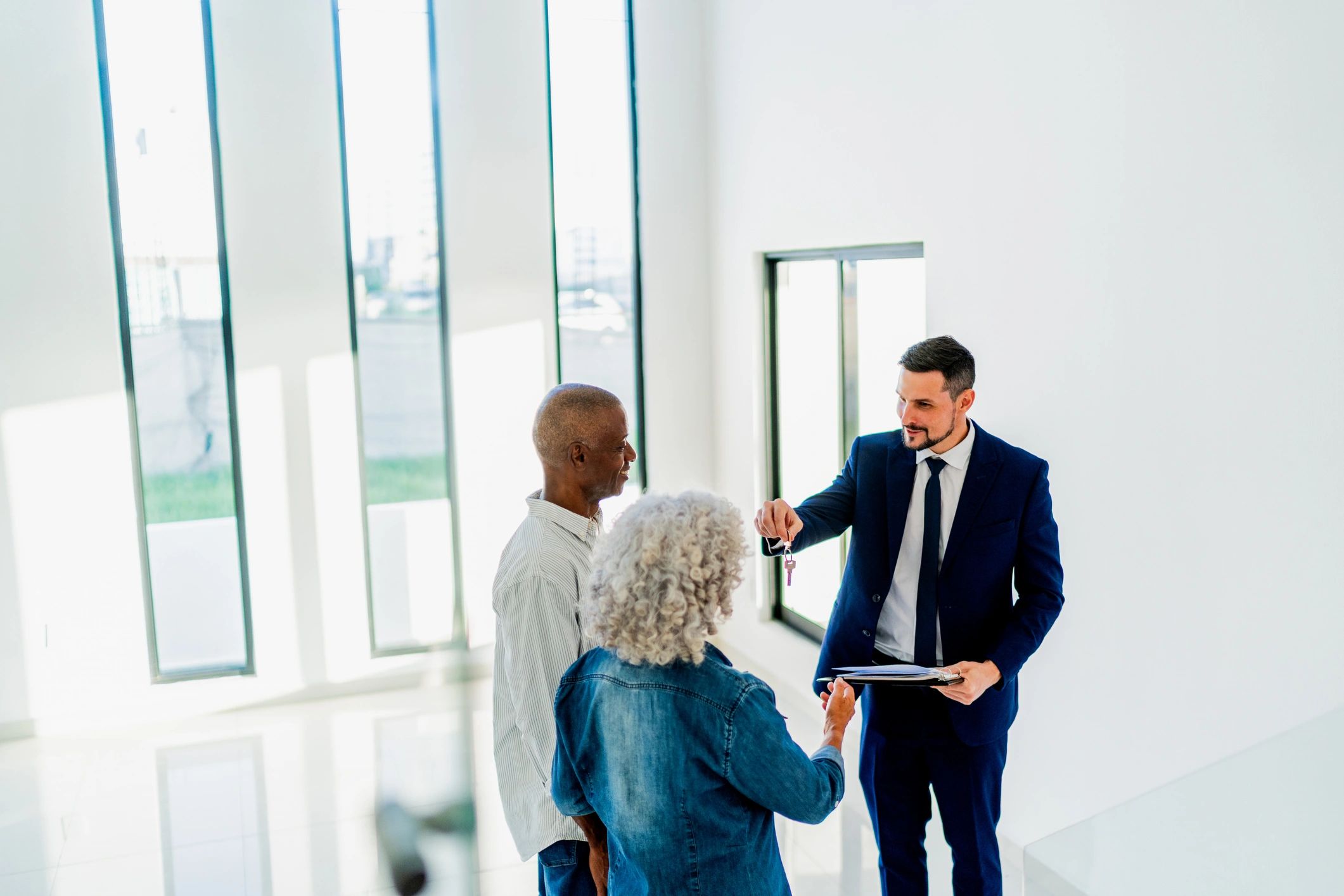 Realtor helping home buyers celebrate a purchase