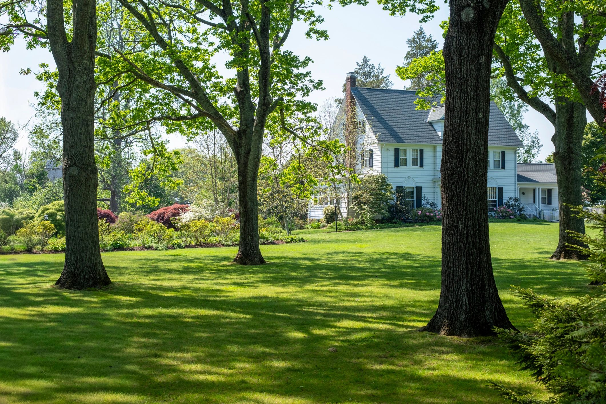 Classic two-story home with green lawn