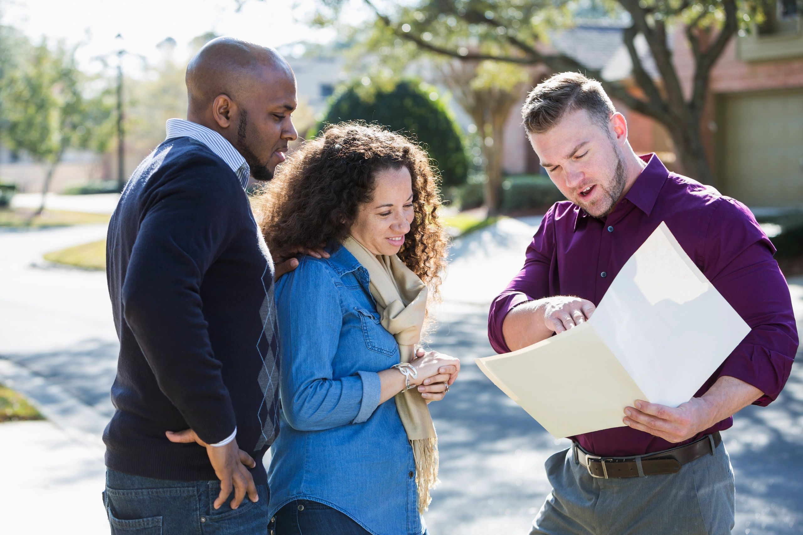 Home buyers meeting with a real estate professional